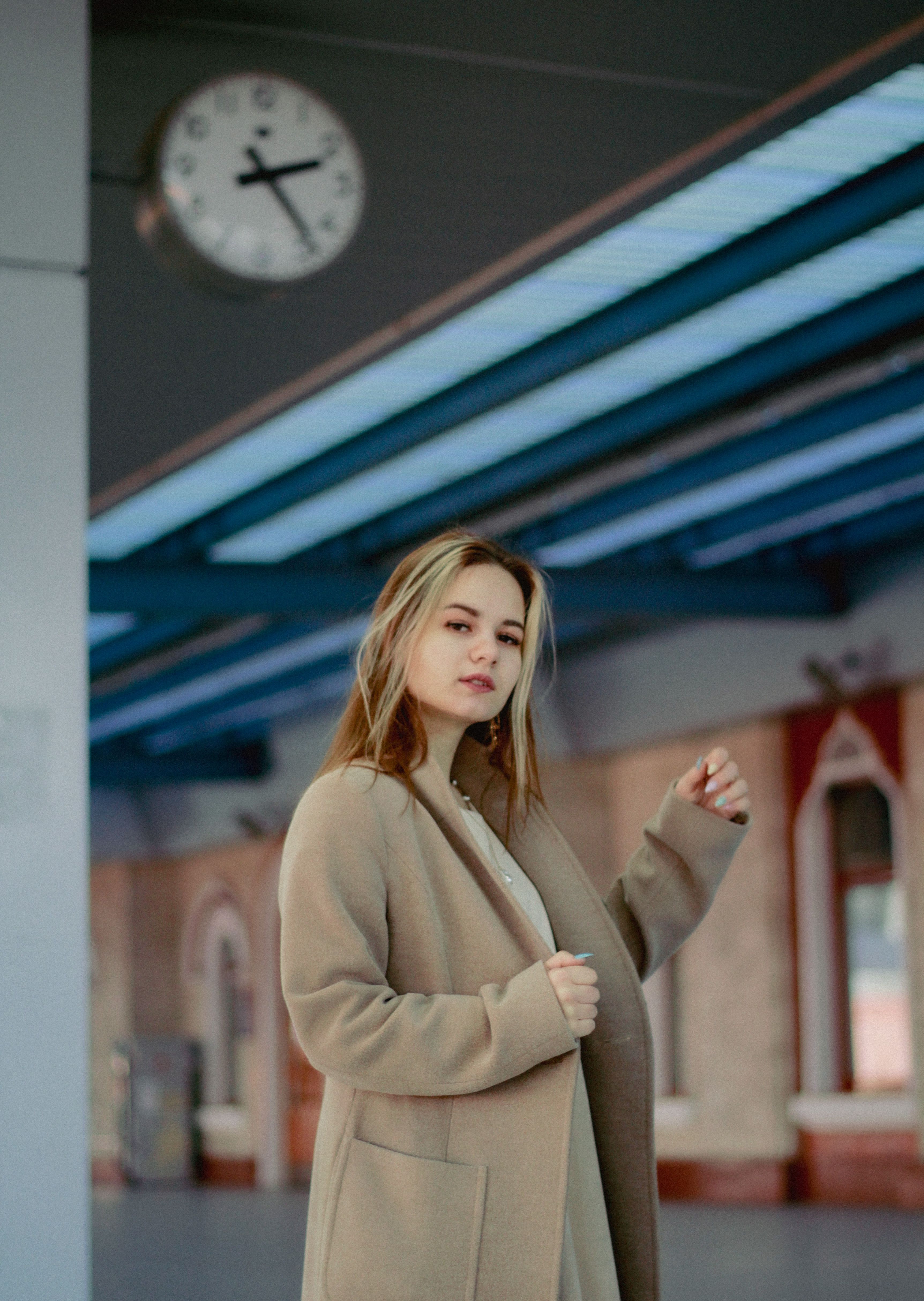 A Woman in a Black Coat Walking on a Street · Free Stock Photo