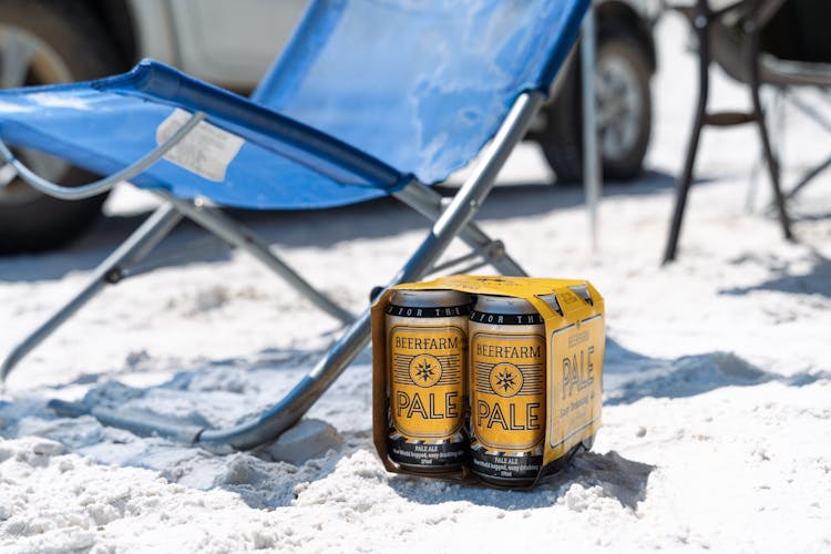 Pack Of Beers On The Beach Sand