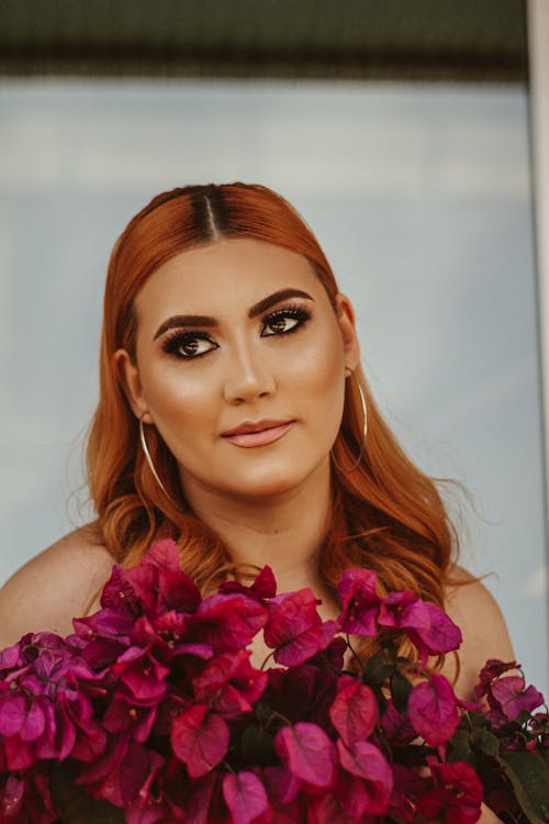 Woman Behind Purple Bougainvillea Flowers