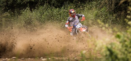 Person Riding Motocross Dirt Bike