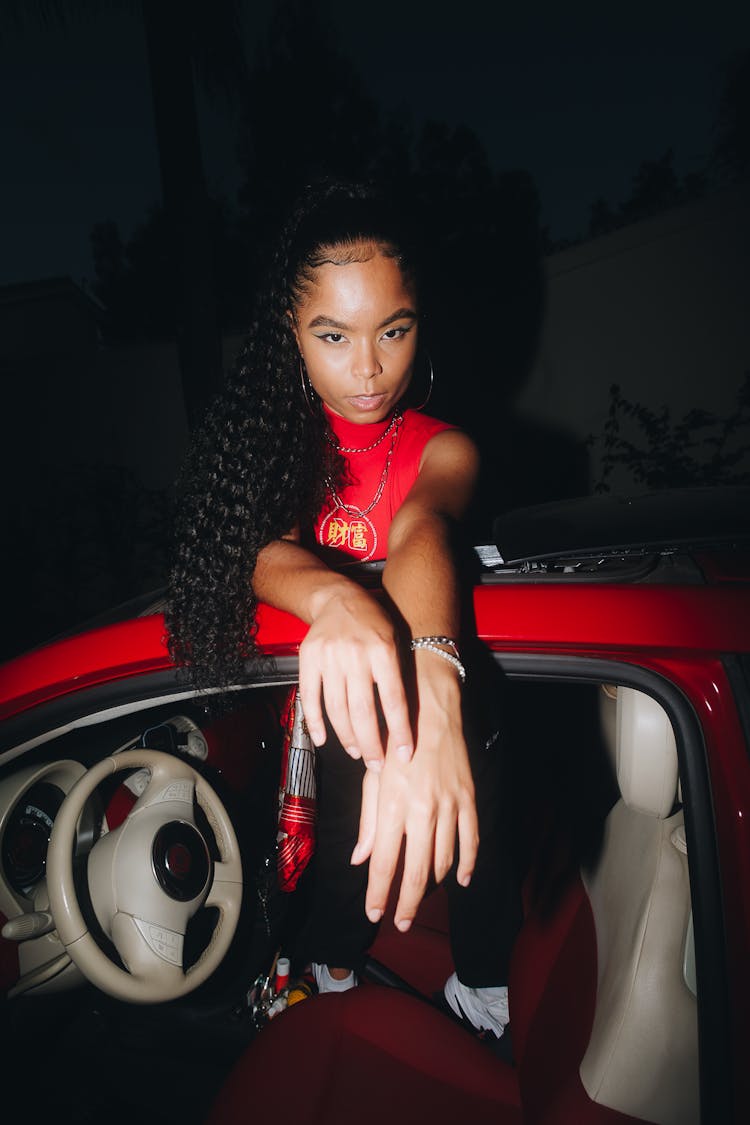 A Woman In Red Top Inside The Top Down Car