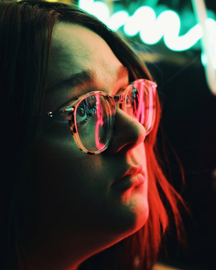 Neon Lights Reflecting On Woman Face