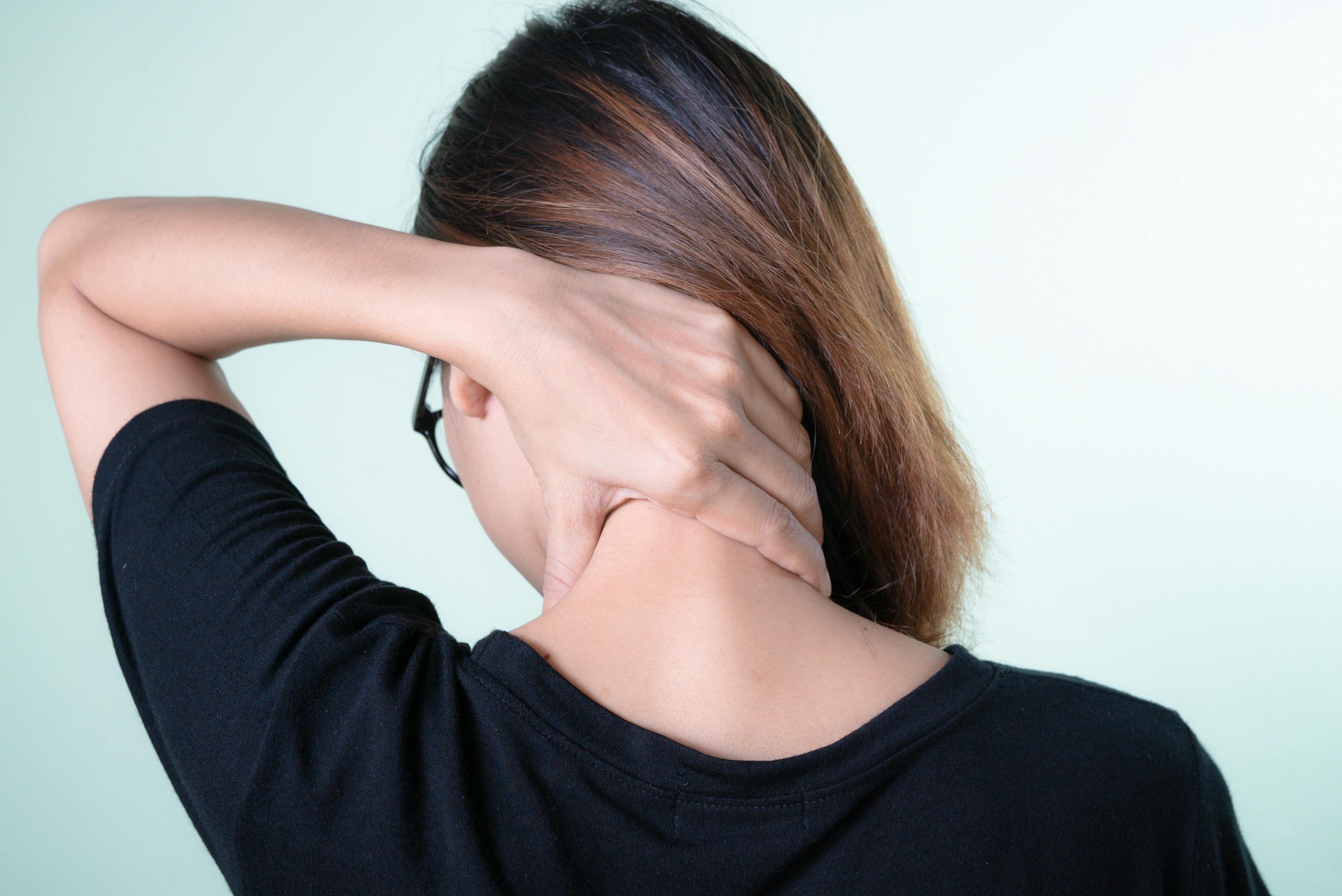 Close-up of Woman Touching Her Neck with Her Hand · Free Stock Photo