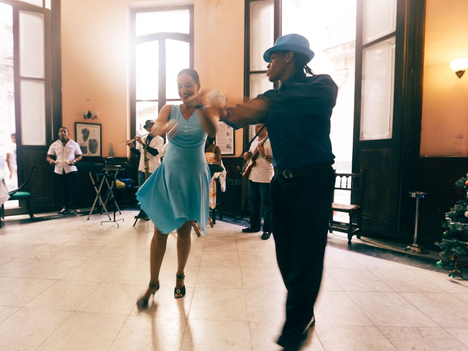 Dancers marching and stepping to a fast merengue beat