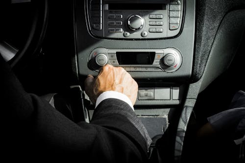 Man In Black Suit Inside Car