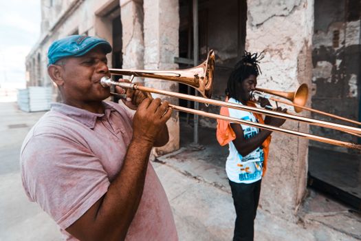 Performers playing a Trombrone
