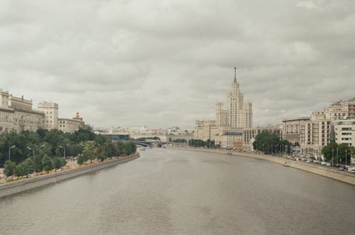 Free A view of Moscow featuring the river and iconic Stalinist architecture. Stock Photo