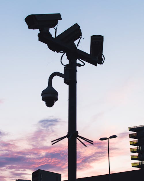 Free Black Lamp Post with Mounted Cameras Stock Photo