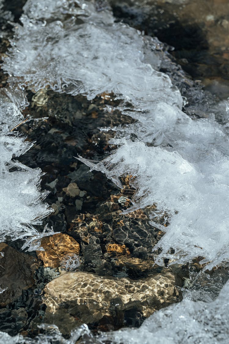 Frozen Ice Crystals On Rocks