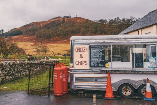 Food truck selling chicken and chips in scenic rural Killin, Scotland.