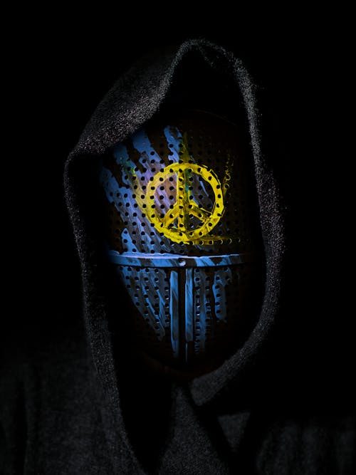 Person in Black Hoodie with Mask