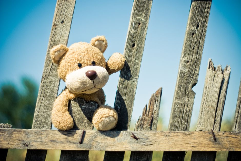 A completed upcycled denim teddy bear sitting on a wooden chair - diy gifts from recycled materials A completed upcycled denim teddy bear sitting on a wooden chair - diy gifts from recycled materials