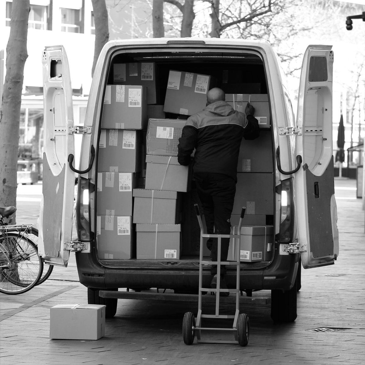 Mover arranging packages inside a van