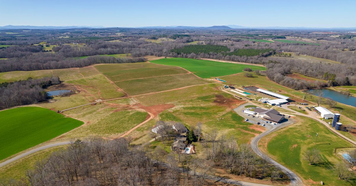Aerial photograph showcasing vast farmland and green pastures in rural North Carolina.