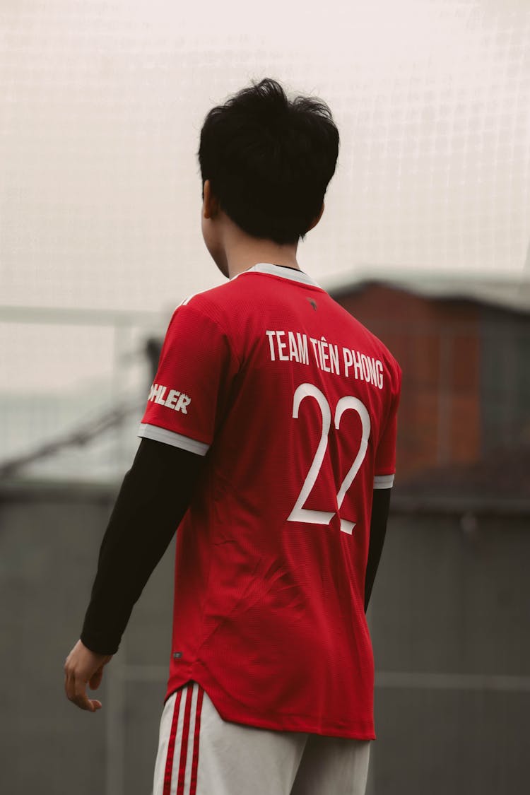 A Man Wearing Red Jersey