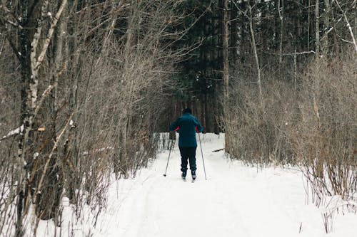 A Man Skiing on Snow