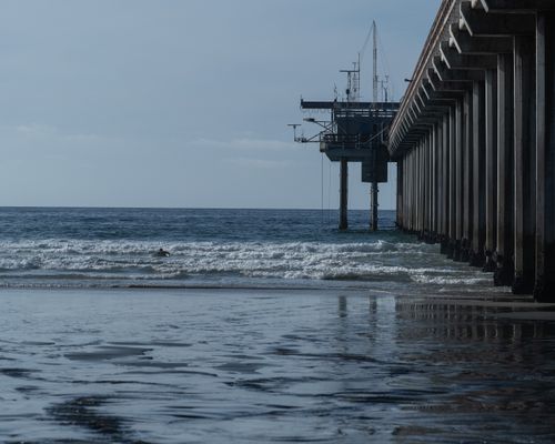 Free View of the ocean and Scripps Pier in La Jolla, capturing the serene coastal beauty of San Diego. Stock Photo