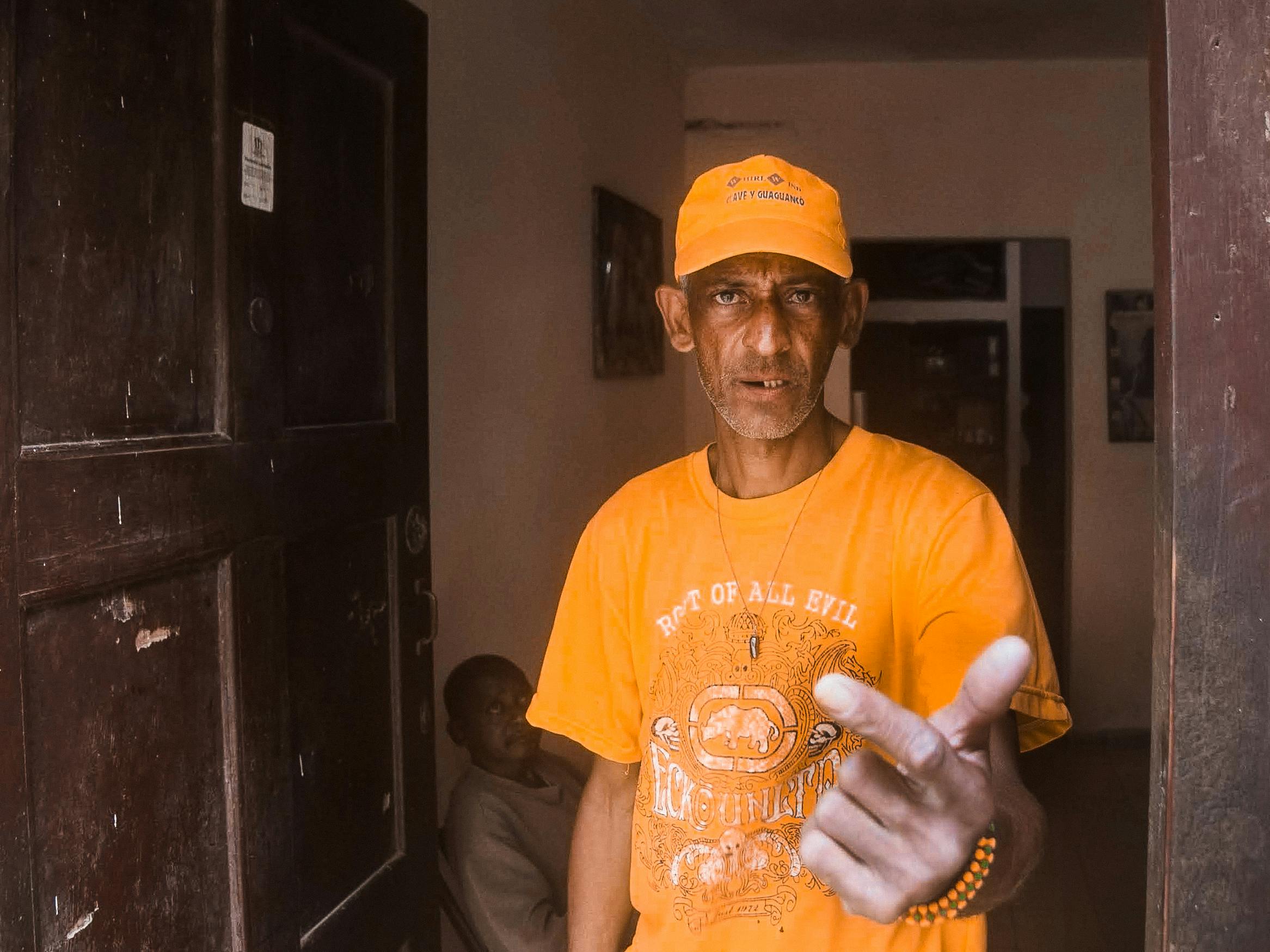 person pointing at cracked garage door seal - garage door bottom seal