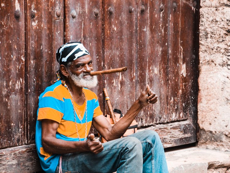 Man Sitting With Pipe