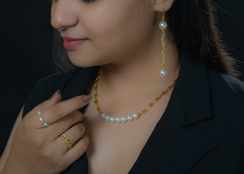 Free A Woman Wearing a Necklace Stock Photo