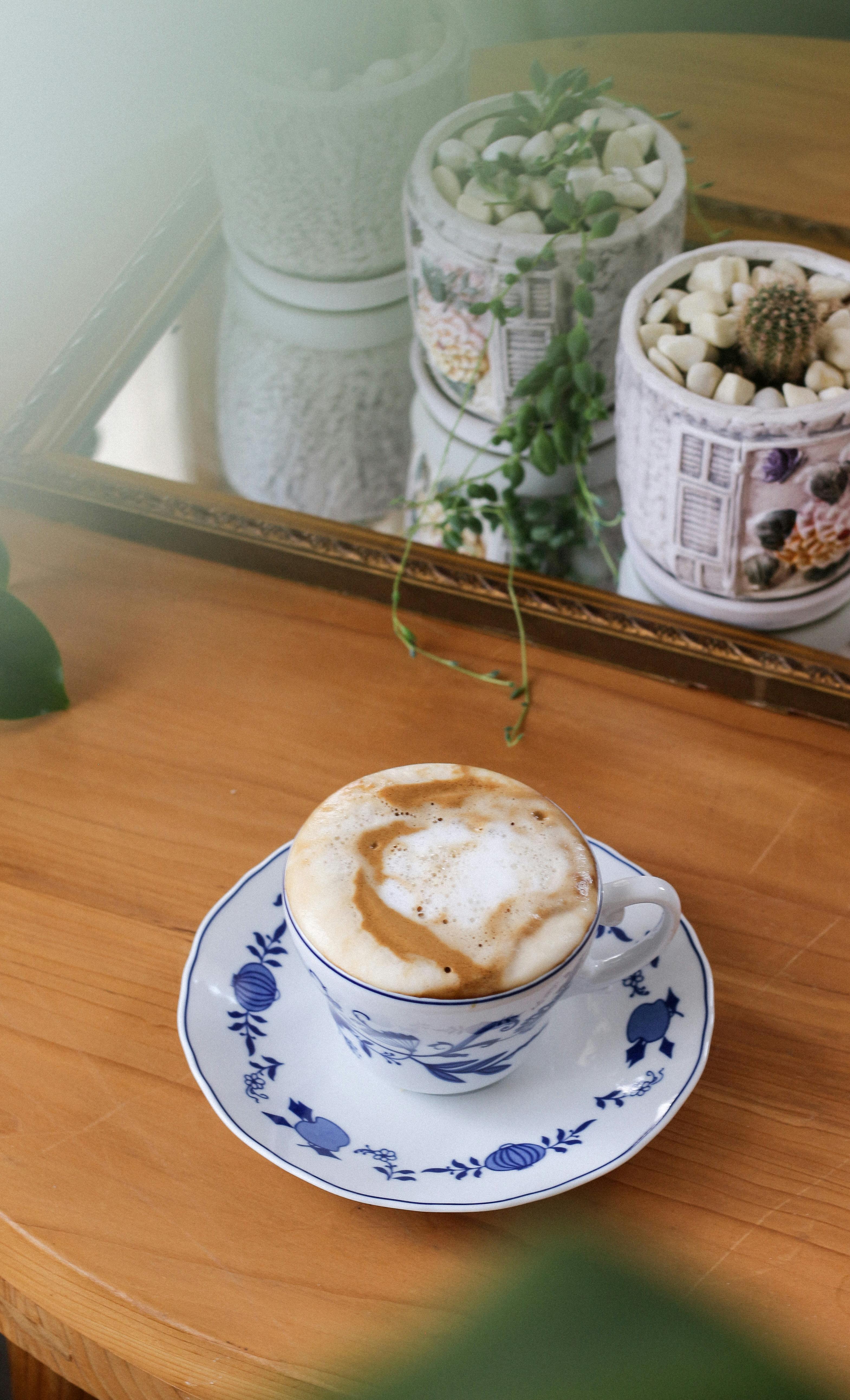 Creamy Coffee in Porcelain Cup · Free Stock Photo