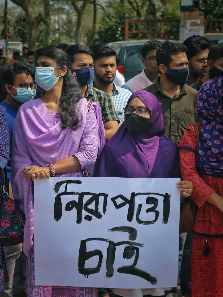 People Protesting With Banner