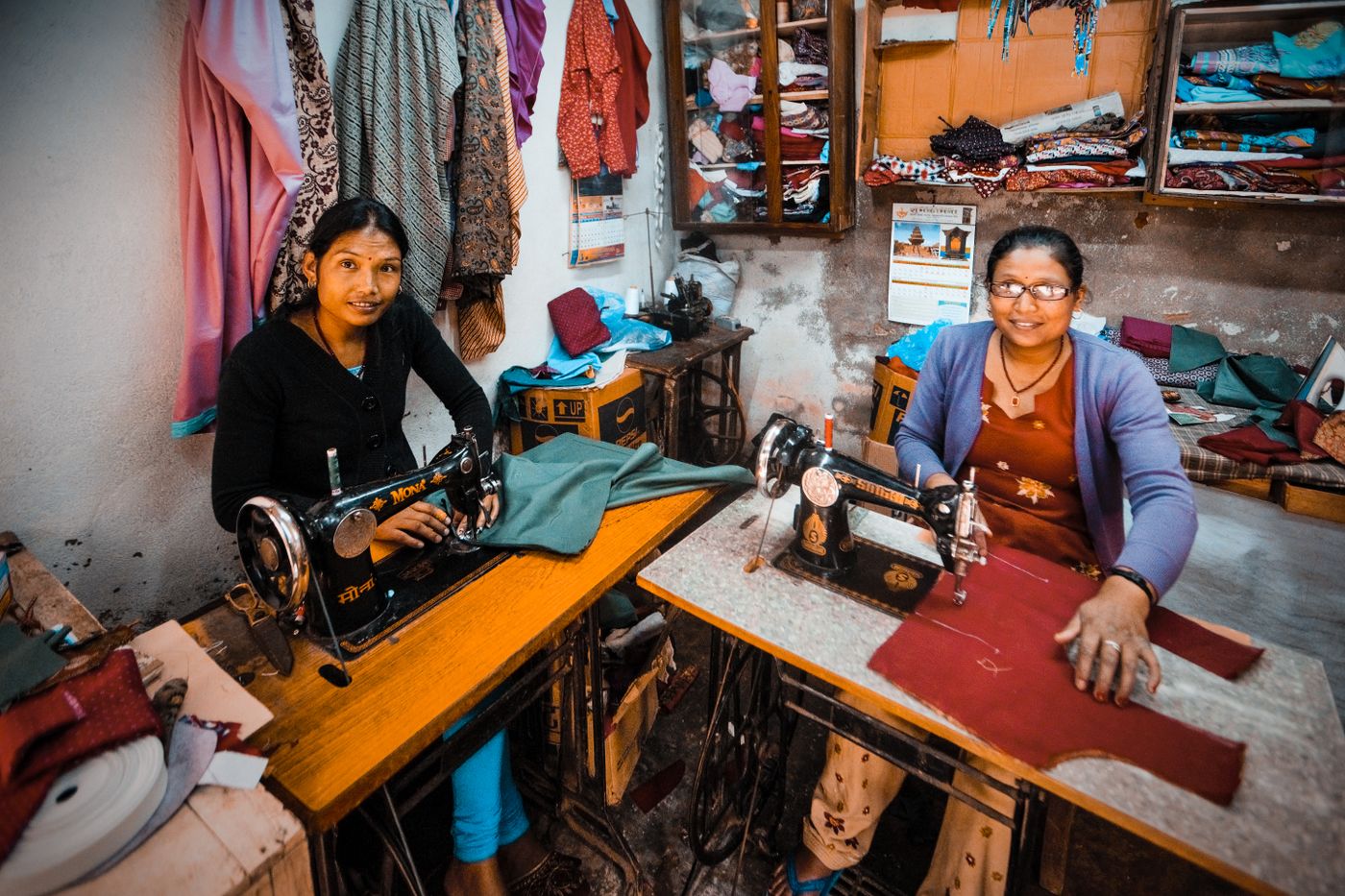 Women working with sewing machines in an Indian workshop, reflecting practical training, livelihood skills, and hands-on learning.