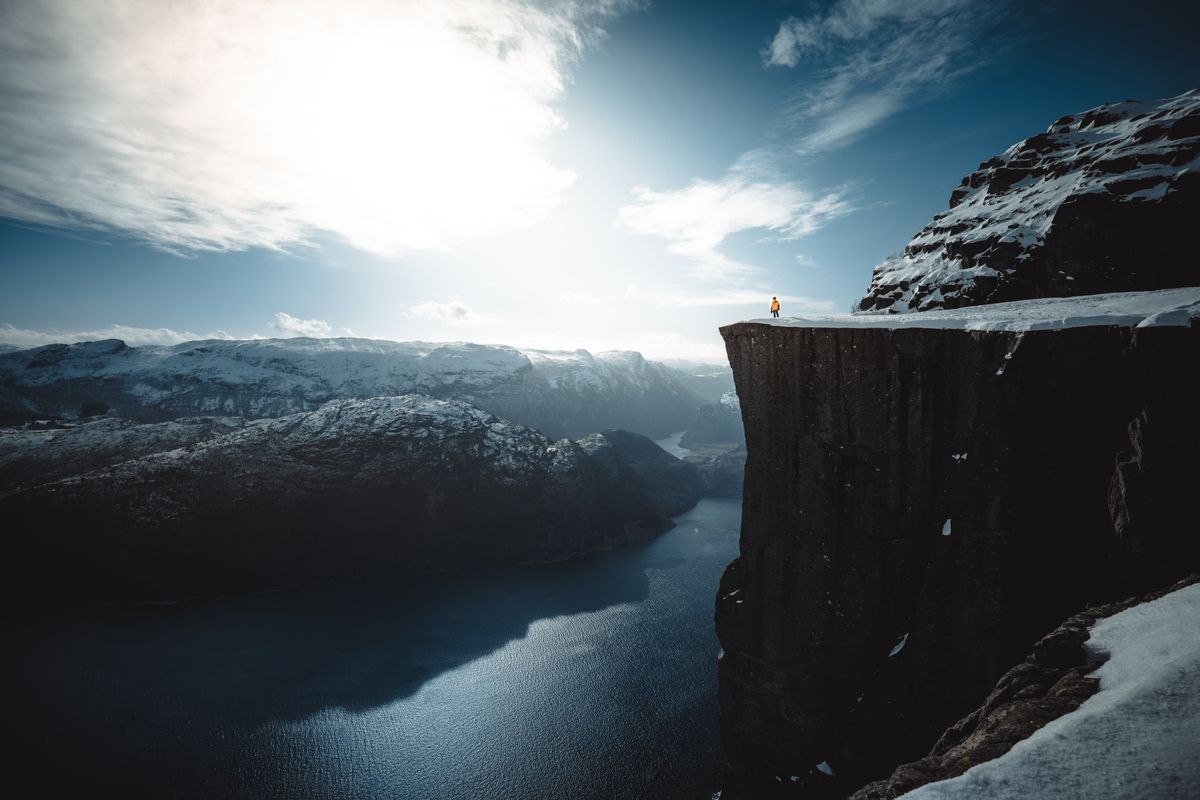 Snow-covered Preikestolen cliff overlooking the Lysefjord in winter