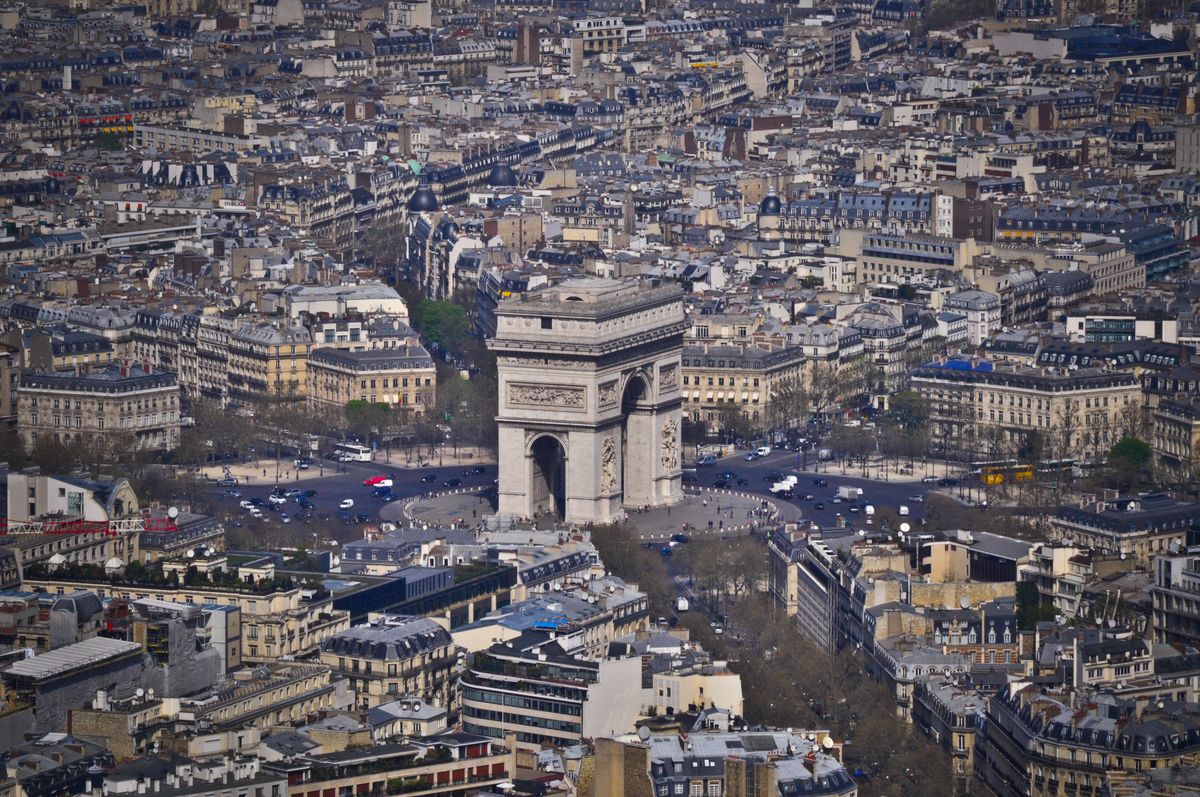 Aerial view of the Arc de Triomphe surrounded by the radiating avenues of the Place Charles de Gaulle in Paris