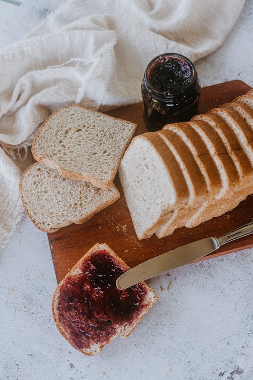 Gratis stockfoto met boven het hoofd, brood, jam