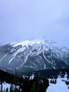 Scenic view of a snow-covered mountain peak in Banff National Park during winter.