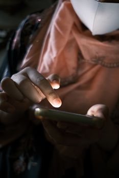 Hands interacting with a smartphone, highlighting modern connectivity.