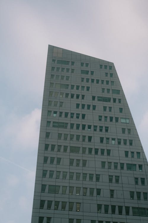 Gray Concrete Building Under Gloomy Sky 