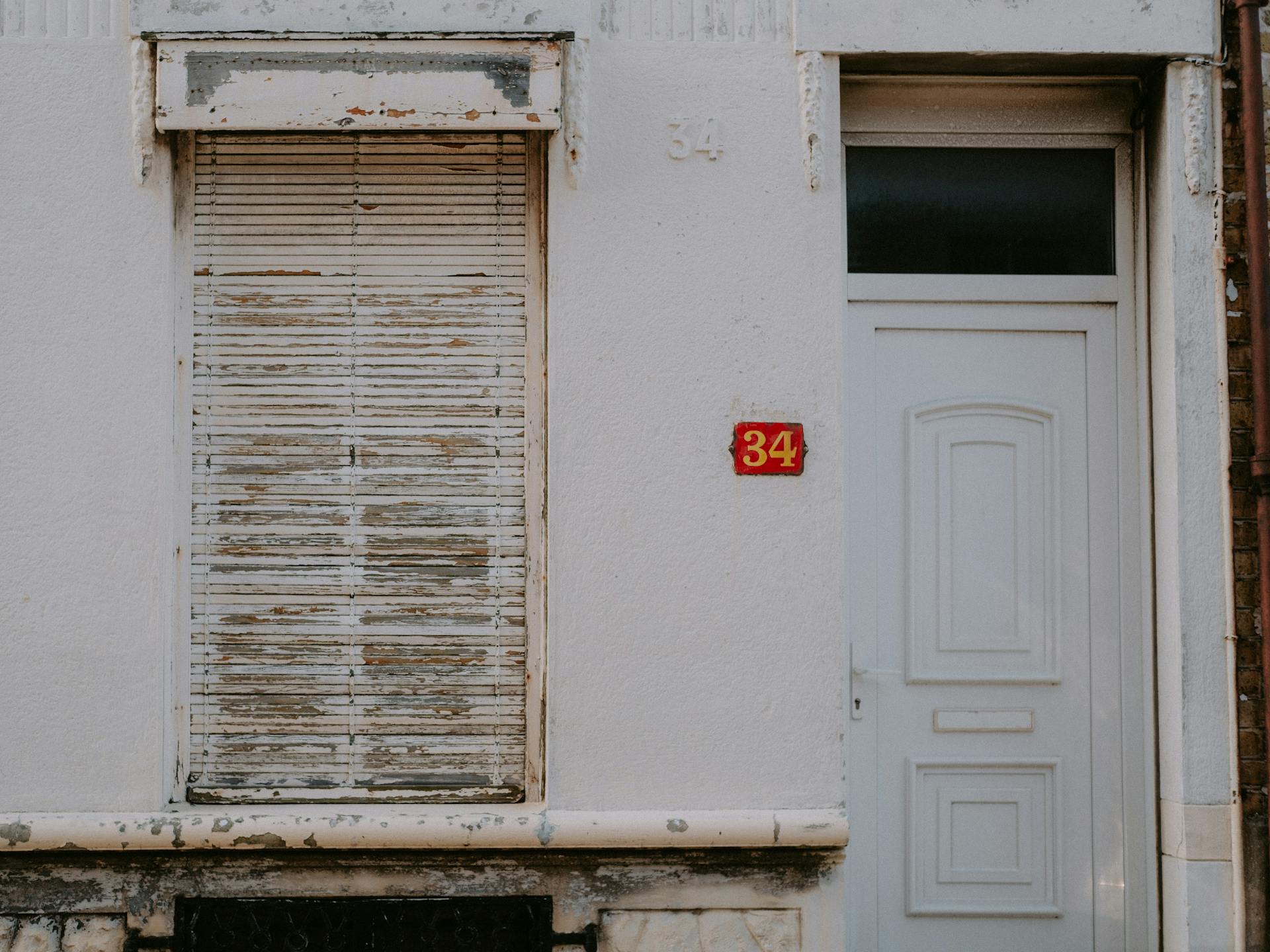 House Number Near the White Wooden Door