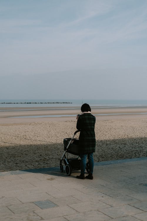 Woman with Stroller near Beach