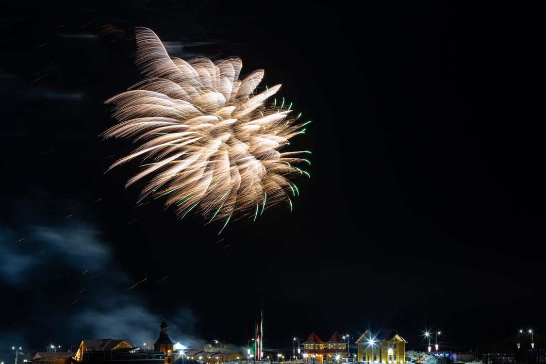 Free Stunning display of fireworks illuminating the night sky over a town in Kamchatka, Russia. Stock Photo