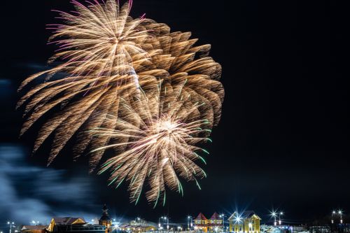 Free Dazzling fireworks display lighting up the night sky above a cityscape in Kamchatka Krai, Russia. Stock Photo