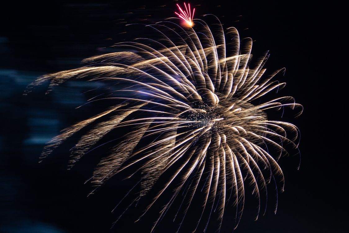 Free A mesmerizing firework display lights up the night sky in Kamchatka, Russia, featuring brilliant bursts and colors. Stock Photo