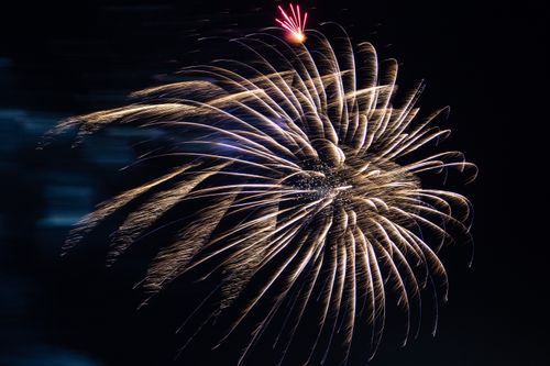 Free A mesmerizing firework display lights up the night sky in Kamchatka, Russia, featuring brilliant bursts and colors. Stock Photo