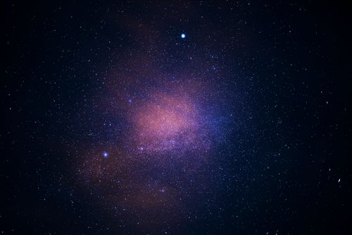 Free A stunning view of the galaxy cluster illuminating the starry sky, capturing the essence of the universe. Stock Photo