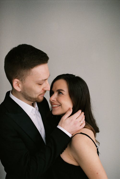 Free Portrait of Elegant Couple Embracing Stock Photo