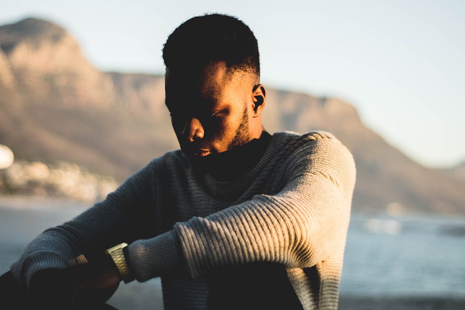 Man Wearing Gray Sweater in Selective Focus Photography