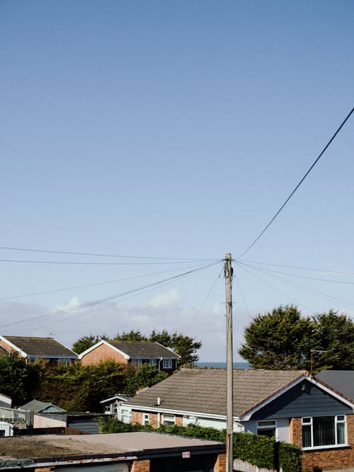 House's Rooftops Under Blue Sky