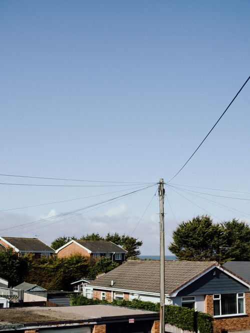 Free Scenic view of suburban homes with a clear sky, capturing serene residential lifestyle. Stock Photo