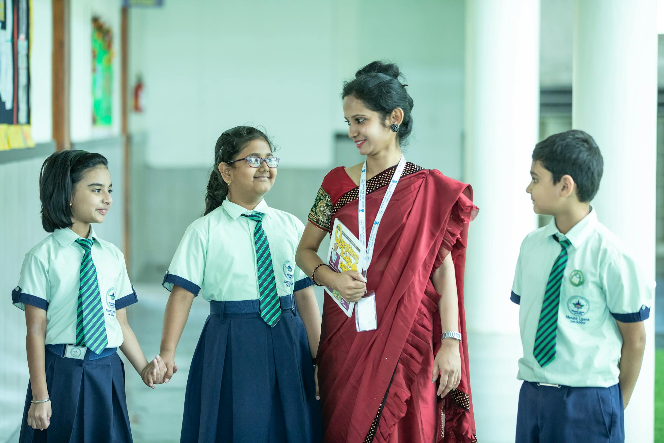 Teacher with Her Students Photo by Anil Sharma from Pexels: https://www.pexels.com/photo/teacher-with-her-students-11367436/