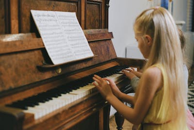 Kids playing piano together