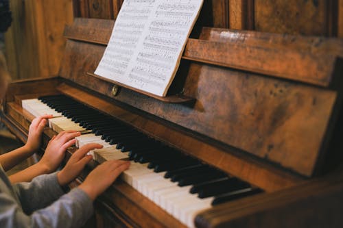 Free Person Playing Piano With Musical Notes Stock Photo