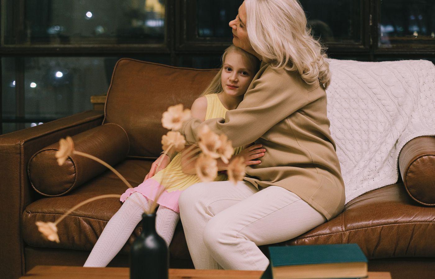 Grandmother sharing a warm hug with her granddaughter.