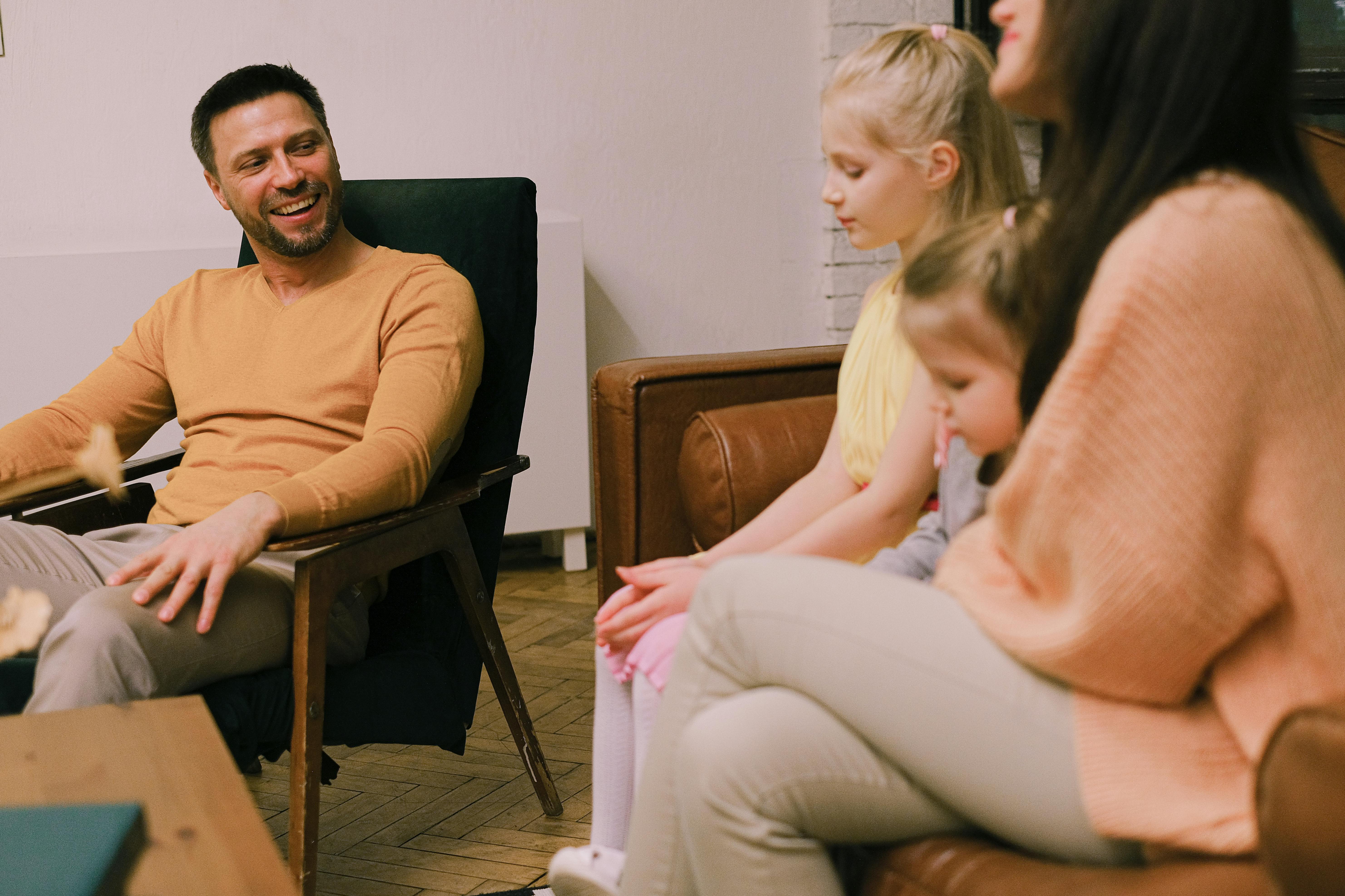 girls with parents in living room