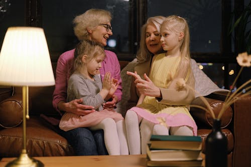 Little Girls Sitting on Their Grandmothers Laps